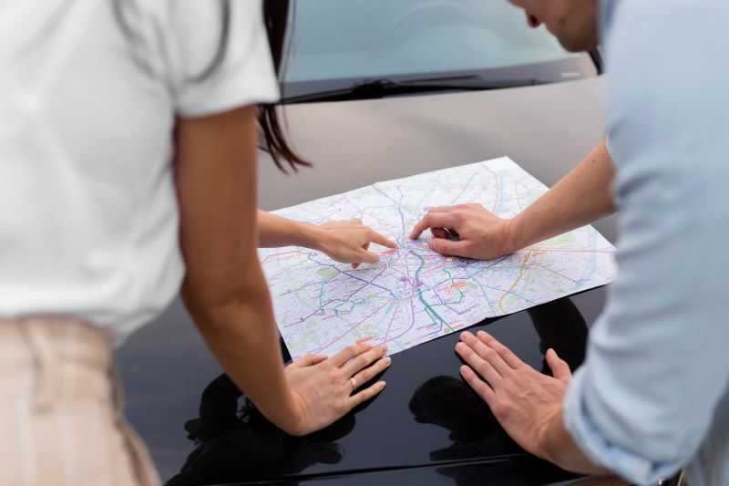 close-up-young-couple-checking-local-map-together.jpg